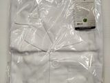 the white shirt is wrapped in plastic and ready to be worn