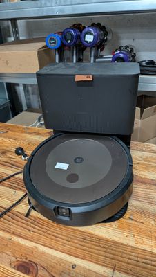 an image of a robotic vacuum cleaner on a wooden table