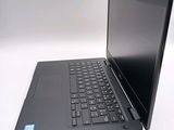 a laptop that is sitting on a white table