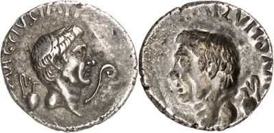 a silver coin with an image of a man on it