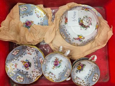 a red box with a bunch of plates and cups