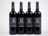 trois bouteilles de vin rouge posées côte à côte sur une table
