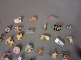 a lot of pins that are on a table