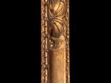 an ornate gold frame with a decorative design on it