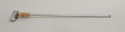 a close up of a metal object on a white surface