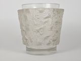 a clear glass with a pattern on it on a white surface