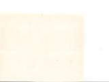 a white sheet of paper on a table with a clock on it