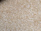 a close up of a beige carpet with a white background