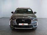 the front view of a grey dsx parked in a showroom