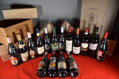 many bottles of wine sitting on a table with a red cloth