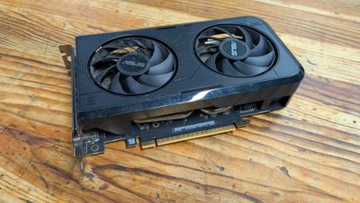 a close up of a video card on a wooden table