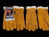 three pairs of brown leather gloves on a black background