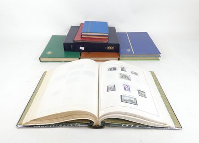 several books are stacked on top of each other on a table