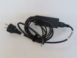 a black power cord that is connected to a charger