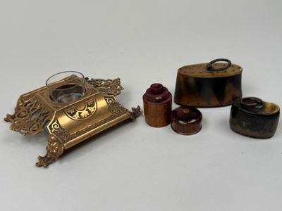 four different types of brass items on a white surface