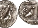Gros plan sur une pièce de monnaie ornée d'un oiseau