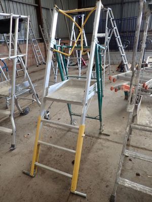 many ladders that are sitting in a building