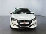 the front view of a white car in a showroom
