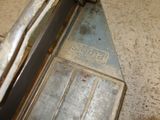 a metal object on the floor of a building