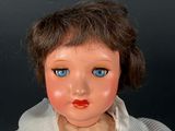 a small doll that is sitting on a table