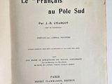 an open book on a white table with a black and white image