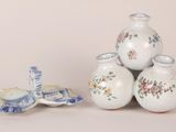 three vases stacked on top of each other on a table