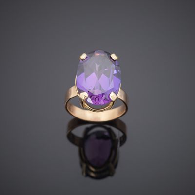 an amethorate and diamond ring, set in 18k yellow gold