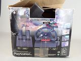 a box with a steering wheel and a game controller in it