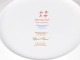 an image of a white plate with a red and blue design on it