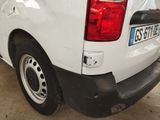 a picture of a white van parked in a garage