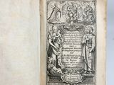 an old book with a black and white drawing on it