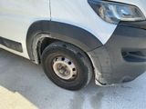 a white van that is parked in a lot