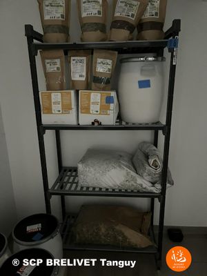 a shelf that has some bags of food on top of it