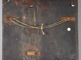 an old wooden easel with a rope on top of it