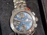 a watch that is in a box on the table