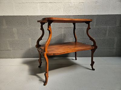 a small table with a shelf on top of it