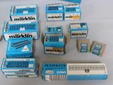 many boxes of markin cigarettes on a table