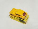 a yellow toy car sitting on top of a yellow box
