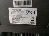 a close up of a black electronic device with a barcode on it