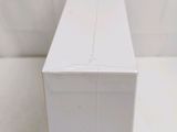a white box that has a toothbrush in it
