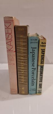 three books that are stacked on top of each other