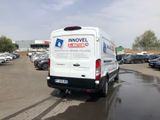 a white van that is parked in a parking lot