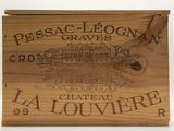 a wooden box with a wooden handle holding a bottle of wine