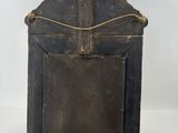 an old wooden box with a metal handle on a white background