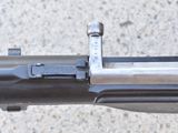 a close up of a machine gun on the ground