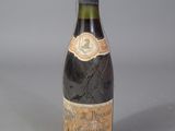 a bottle of wine that is sitting on a table