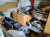 a box of stuff sitting on a table in a room