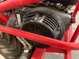 a close up of a motor bike with a red frame