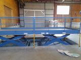 a blue scissor in a building with a skateboard on the ground