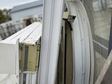 a close up of a window with a yellow tape on it